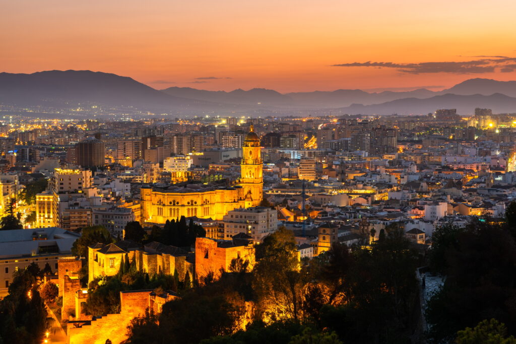 Malaga skyline, Spain cityscape with Cathedral, City Hall and Alcazaba citadel of Malaga at dusk